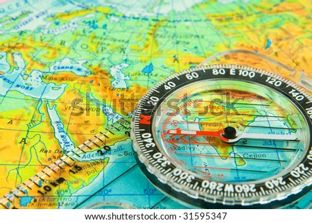 Photo of colored globe and compass - teaching materials