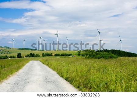 Wind power farm installation in sunny day