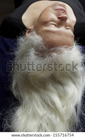 older woman with long, flowing silver hair