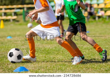 Football soccer match for children. kids playing soccer game tournament