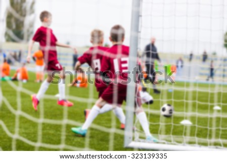 Blurry sport background of football soccer match. Training and game for children.