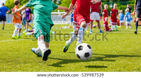 Children Playing Football Soccer Game on Sports Field. Boys Play Soccer Match on Green Grass. Youth Soccer Tournament Teams Competition