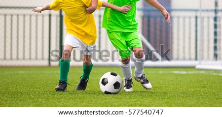 Running Children Football Soccer Players with Ball. Footballers Kicking Football Match on the Pitch. Young Teen Soccer Game. Youth Sport Background
