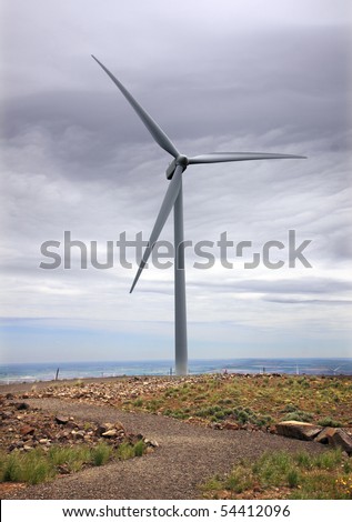 Lone wind turbine on top of high hill in eastern Washington