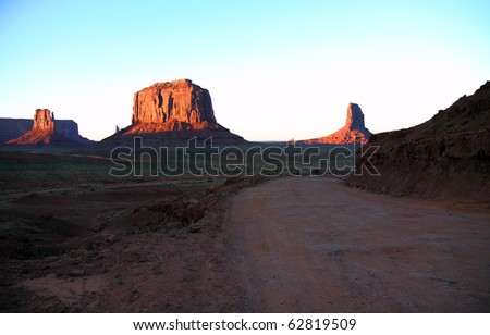 Red sandstone rock formations give Monument Valley an unearthly looking landscape that is unique and interesting to visit