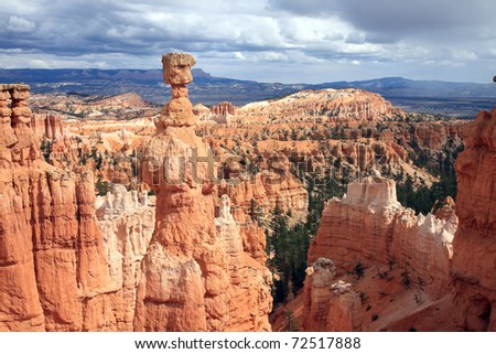 Dramatic landscape of Bryce Canyon National Park is populated with vibrant orange sandstone spires sculpted by the forces of nature.  Erosion caused by wind and rain carve interesting shapes.