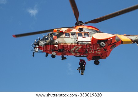 ALICANTE COAST, SPAIN - FEBRUARY 15. Search and rescue maneuvers by the Spanish army helicopter at a conference of Emergency and Public Safety in Altea, Spain, on February 15, 2015