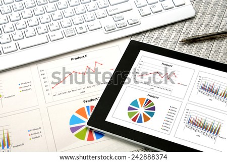 Digital tablet on business document