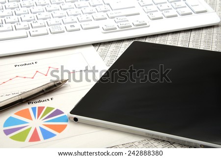 Digital tablet on business document