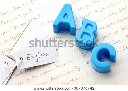 English education, alphabet toy on notebook