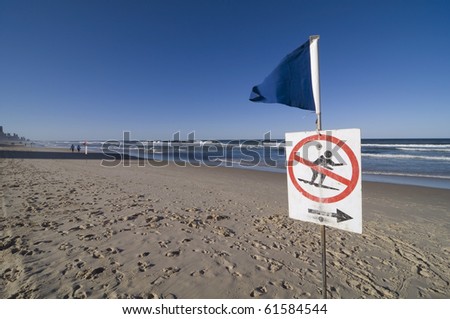A no surfing warning sign on the beach at gold coast