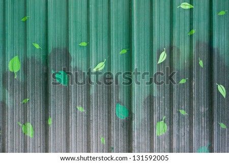 Corrugated iron fence painted leaves.