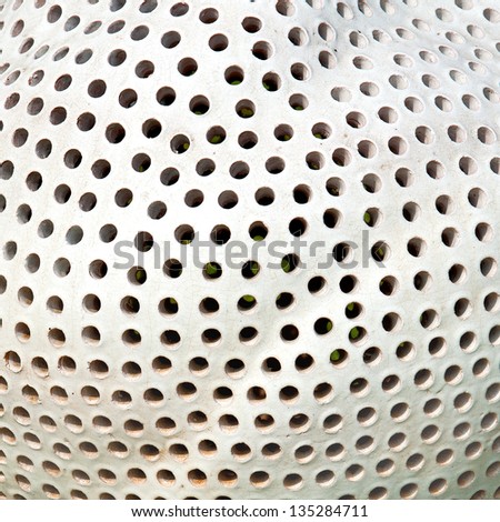 Holes pattern on ceramic surface. Abstract background.
