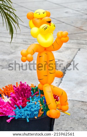 Balloon animals (tigers) see beautiful cute kids like bright colors.