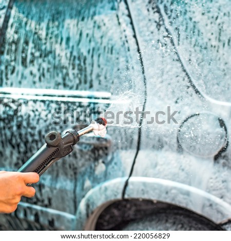 cleaning car by foam from clean care care service