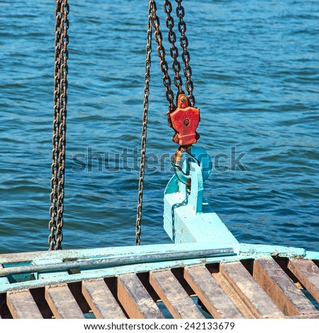 Industrial lifting hook with chains and beam