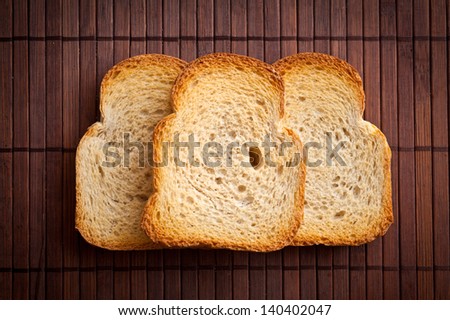 White bread toast on bamboo mat.