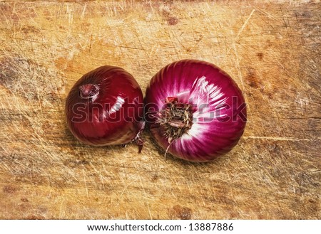 Spanish red onions on wood background