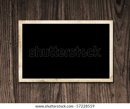 Vintage blank photo on wooden table with copy space.