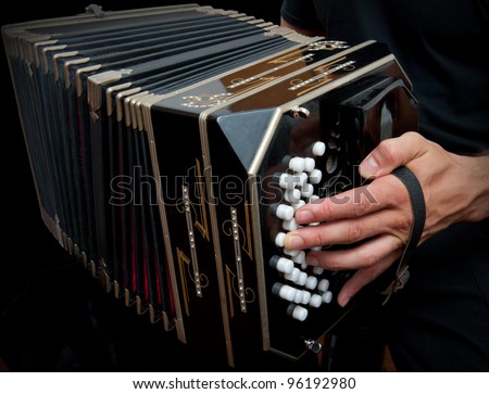 Playing the bandoneon, traditional tango instrument, Argentina.