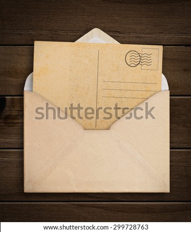 Vintage envelope with paper on table.