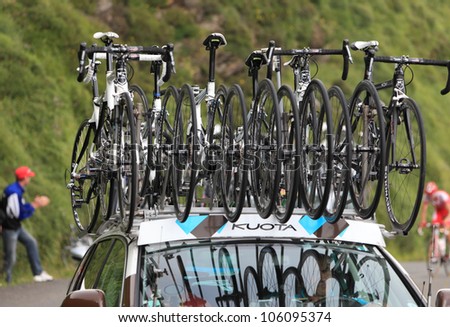 BEOST,FRANCE-JUL 15:Image of Kuota spare bicycles on the roof of the race car of the AG2R La Mondiale team climbing the mountain pass Aubisque, in the 13 stage of \