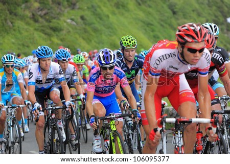 BEOST,FRANCE-JUL 15:The peloton climbing the mountain pass Aubisque in the 13 stage of \
