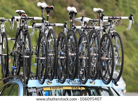 BEOST,FRANCE-JUL 15:Image of Specialized spare bicycles on the roof of the race car of Saxo Bank-Sungard team climbing the mountain pass Aubisque, in the 13 stage of Le Tour de France, on July 15 2011