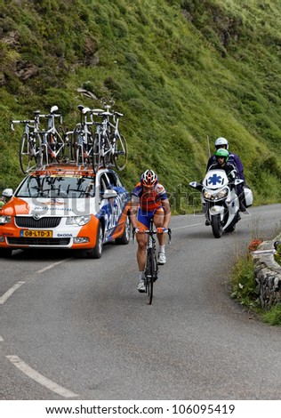 BEOST,FRANCE-JUL 15:The cyclist Maarten Tjalingii (Rabobank) and the car of his team climbing the mountain pass Aubisque, in the 13 stage of \