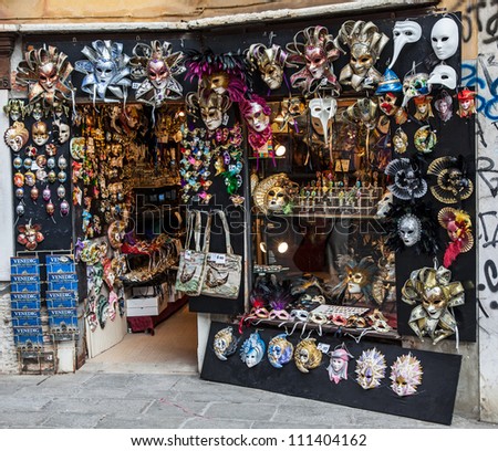 VENICE,ITALY- FEBRUARY 19:A shop full of traditional masks and souvenirs in a small street,in the Carnival days on February 19,2012. During the Carnival people wear masks to conceal their identity.