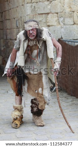 NOGENT LE ROTROU,FRANCE,MAY16:Unidentified leprous man during a historical reenactment festival near the Saint Jean Castle on May 16,2010 in Nogent le Rotrou,France