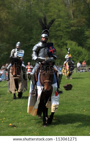 HARCOURT,FRANCE, APRIL 17:Two medieval knights ready to start the fight, during a tournament, to celebrate 1100 years of existence of Normandy on April 17, 2011, in Harcourt.