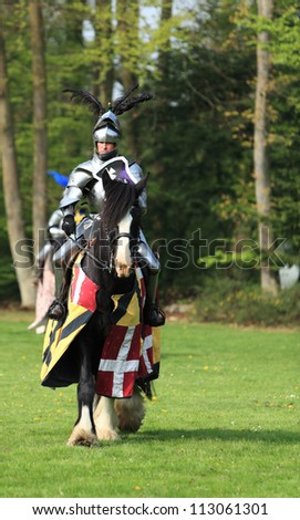 HARCOURT,FRANCE, APRIL 17:A medieval knights ready to start the fight, during a tournament, to celebrate 1100 years of existence of Normandy on April 17, 2011, in Harcourt.