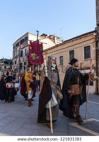 VENICE,ITALY-FEB. 26:People disguised in medieval costumes marching in a medieval characters parade on February 26, 2011 in Venice. In 2011 the Venice Carnival was held between 11- 21 February.