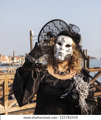 VENICE-FEB 18:Portrait of an unidentified person in a traditional mask on February 18, 2012 in Venice. In 2012 the Venice Carnival was held between 11- 21 February.