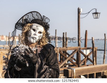 VENICE-FEB 18:Portrait of an unidentified person in a traditional mask on February 18, 2012 in Venice. In 2012 the Venice Carnival was held between 11- 21 February.