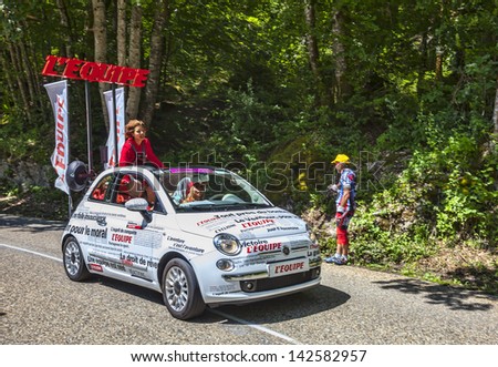 LA PALUD,FRANCE - JUL 13: Car of L\'Equipe newspaper during the passing of the Publicity Caravan on the road to mountain pass Granier in the 12 stage of the Le Tour de France on July 13 2012 in La Palud.