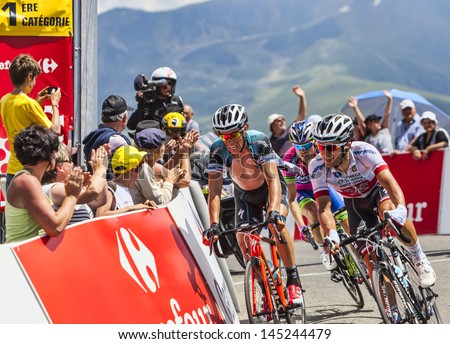 VAL LOURON,FRANCE- JUL 7:Three cyclists, Sylvain Chavannel, Michal Kwiatkowski and Damiano Cunego passing the Col de Val Lauron-Azet during during stage 9 of Le Tour de France on July 7, 2013