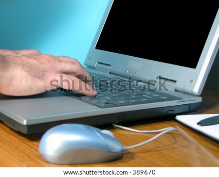 Office desk with hands typping on a computer.You can put what do you need on the screen.