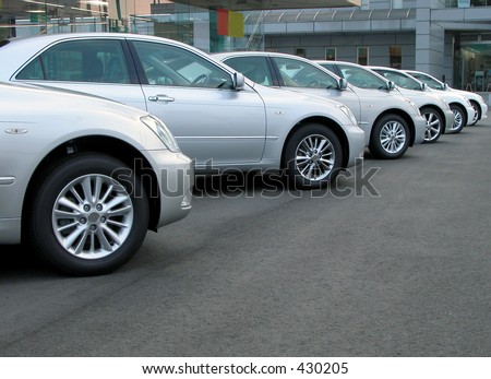 stock photo Cars row in front of a cars shop