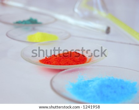 Pure chemical substances on clock glasses on a laboratory desk