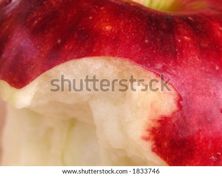Extreme close-up of an apple with a bite missing
