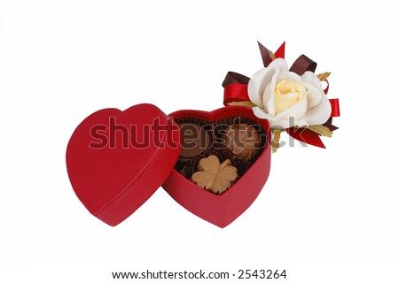 Red heart shape chocolate box and white rose isolated over white background