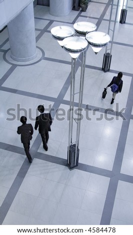 Upper view of a modern hall with people walking.