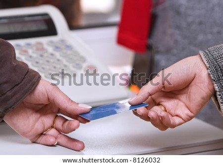 Detail of a credit card payment moment in a shop.