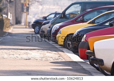 stock photo Row of different cars parked in a crowded city