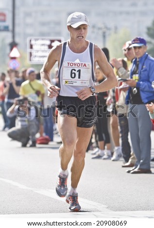 BUCHAREST, ROMANIA, OCT. 10 Marathon man crossing the finish line at the Bucharest International Marathon 2008.