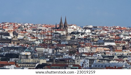 Overview of Prague featuring the Ludmila Church towers.