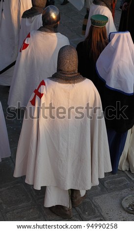 VENICE, ITALY-FEB 26:Unidentified people disguised in templar knights at Sestiere Castello participate in the Carnival of Venice on February 26, 2011.In 2012 the Carnival is between February 11-21.