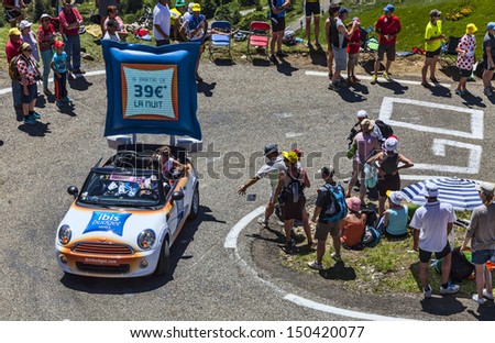 PORT DE PAILHERES,FRANCE- JUL 6:A car advertising Ibis Budget Hotels,during the passing of the publicity caravan on the road to the Col de Pailheres in the stage 8 of Le Tour de France on July 6 2013